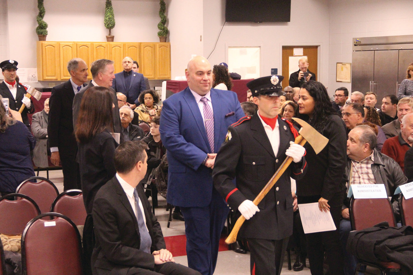 Escorted by the Cranston Fire Department color guard, Michael Farina, who was reelected City Council President, precedes his peers to the stage.